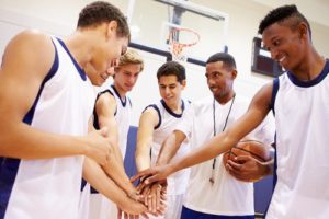 Basketball team giving each other a team hand shake