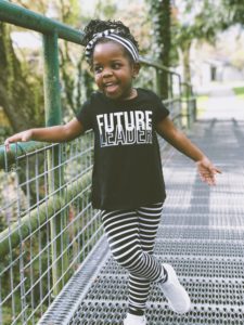 Young girl with t-shirt that says Future Leader