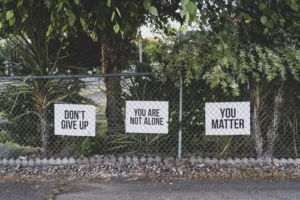 Fence with inspirational signs attached